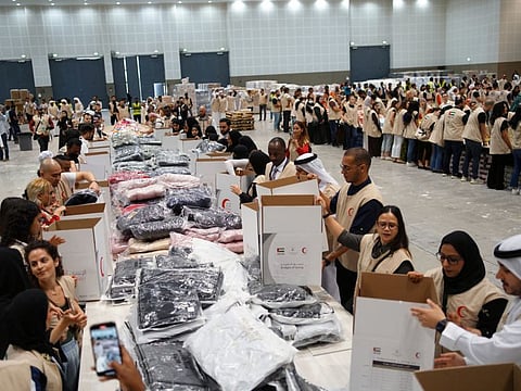 Volunteers come together at Concourse 1 Trade Centre Arena to pack relief supplies for the quake-hit.