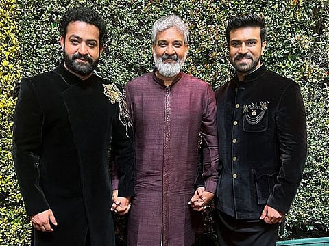 Director SS Rajamouli with actors Ram Charan and Jr NTR at the 95th Academy Awards.