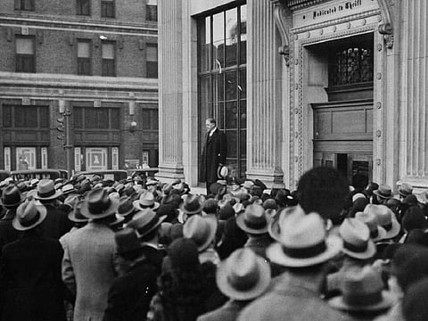 LESSONS OF HISTORY: John Poole, president of the Federal American National Bank in Washington in 1933, spoke from a window ledge of the Perpetual Building Loan Association to assure worried shareholders that the Perpetual was a sound bank and that the rumor was caused by false and unfounded rumours. About 4,000 US banks collapsed that year.