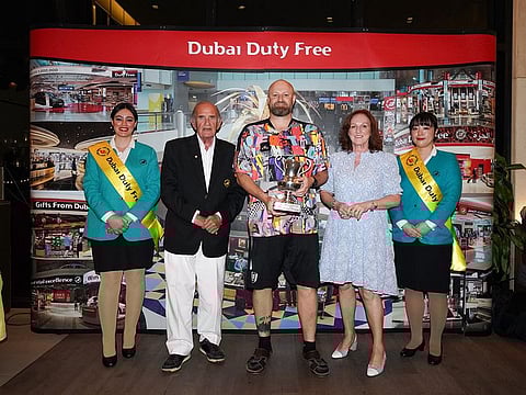James Ritchie winner of the 2023 Mark Fahy Memorial Golf Tournament with officials from Dubai Duty Free.