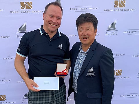 Monthly Medal winner Anders Kron (left) and Dubai Creek Men's Captain Gene Cha.