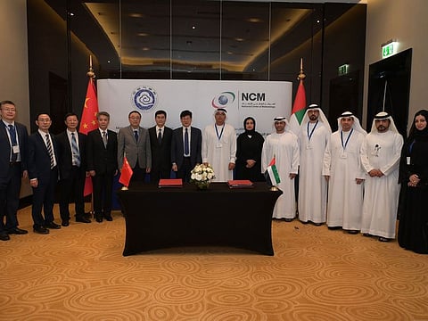 Officials from National Centre of Meteorology (NCM) in the UAE and the China Meteorological Administration (CMA) after the signing of the Memorandum of Cooperation in Abu Dhabi on Wednesday