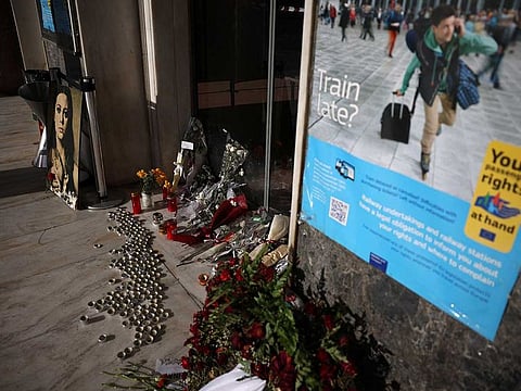 Flowers and candles are placed at the entrance of Athens central train station during a 24-hour nationwide strike over the country's deadliest train disaster last month, Athens, Greece, March 16, 2023.