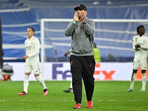 Liverpool's German coach Jurgen Klopp applauds fans at the end of the UEFA Champions League last 16 second leg match against Real Madrid.