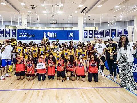 Winners of the girls and boys titles along with legends at the end of the second Junior NBA Abu Dhabi League.