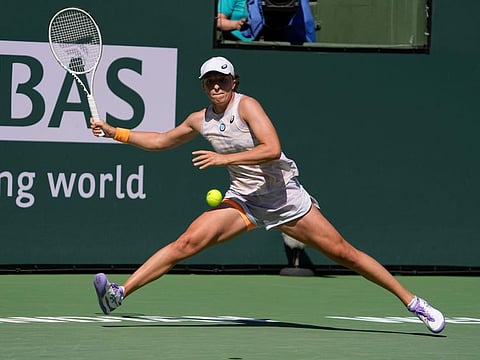 Iga Swiatek of Poland returns to Sorana Cirstea of Romania at Indian Wells on Thursday.