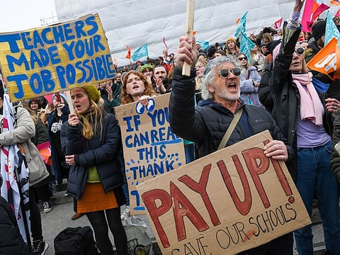 Striking junior doctors, civil servants and teachers attend a rally at Trafalgar Square in London.
