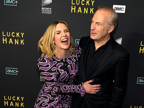 Bob Odenkirk, right, the star and executive producer of the AMC television series 'Lucky Hank', shares a laugh with actor Rhea Seehorn at the premiere of the series on March 15, 2023, at the London Hotel in West Hollywood, California.