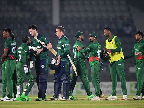 Bangladesh's players shake hands with Ireland's players at the end of play of the first one-day international (ODI) at the Sylhet International Cricket Stadium in Sylhet.
