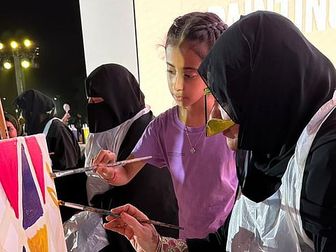 Emirati women present their artwork during the festival at Mushrif National Park