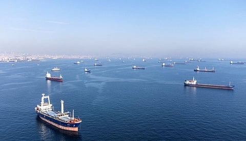 Commercial vessels including vessels which are part of Black Sea grain deal wait to pass the Bosphorus strait off the shores of Yenikapi during a misty morning in Istanbul on October 31, 2022.