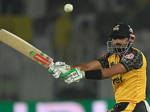 Peshawar Zalmi's captain Babar Azam plays a shot during the Pakistan Super League (PSL) T20 cricket match against Quetta Gladiators at the Rawalpindi Cricket Stadium, in Rawalpindi.