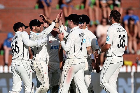 New Zealand players celebrate Sri Lanka's captain Dimuth Karunaratne being caught on day three of the second Test cricket match between New Zealand and Sri Lanka at the Basin Reserve in Wellington.