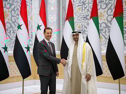 Syrian President Bashar Al Assad (left) with President His Highness Sheikh Mohammed bin Zayed Al Nahyan in Abu Dhabi on Sunday