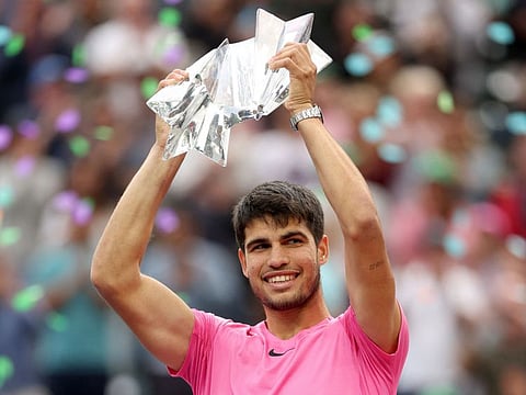 Carlos Alcaraz of Spain poses with the trophy after defeating Daniil Medvedev of Russia during the Men's Final of the BNP Paribas Open at the Indian Wells Tennis Garden in Indian Wells, California.