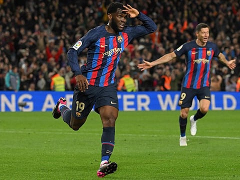 Barcelona's Franck Kessie celebrates after scoring his team's winner during the Spanish league match against Real Madrid CF at the Camp Nou stadium in Barcelona.