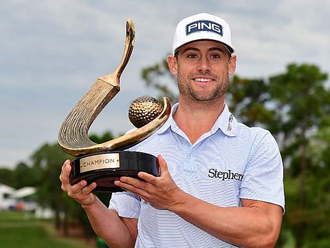 Taylor Moore with the Valspar Championship trophy