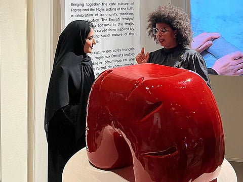 Alya Almazrouei (left) says her ceramic piece combines the culture of cafes in France and the atmosphere of the traditional councils of the Emirates