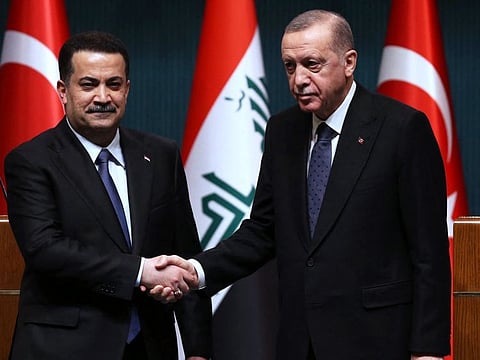 Turkish President Recep Tayyip Erdogan (right) and Iraqi Prime Minister Mohammad Shia Al Sudani shaking hands during a joint press conference after their meeting at the Presidential Palace in Ankara on March 21, 2023.