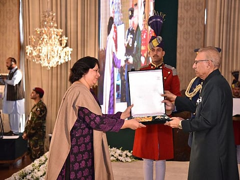 President Dr Arif Alvi conferring the Pakistan Civil Award of Nishan-i-Imtiaz on the late Ahmed Ghulam Ali Chagla in recognition of his services in the field of Art (Musician/Composer) at the Investiture Ceremony on Pakistan Day, held at Aiwan-e-Sadr, Islamabad. The award is being received by the Secretary Ministry of Information and Broadcasting Shahera Shahid.