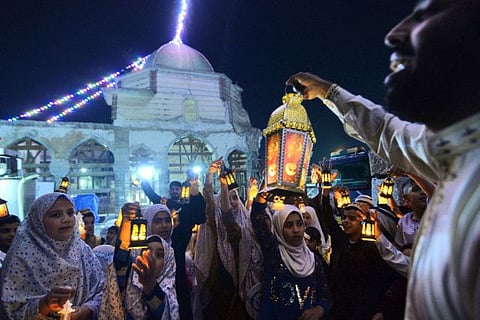 Iraqi children carry Ramadan lanterns and gather outside the Al Nuri Mosque during an event called by the Baytna Foundation for Culture and Arts in the Old City of Mosul, on the eve of the start of Ramadan.
