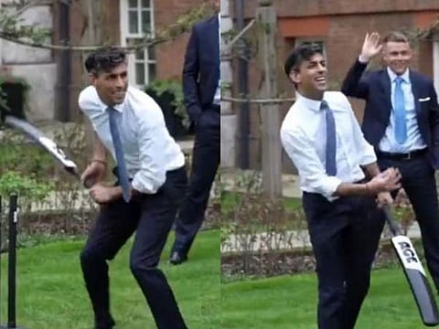 British PM Rishi Sunak playing cricket during a reception for the World Cup-winning England team.