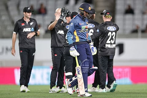 Sri Lanka's Kasun Rajitha walks off after being dismissed during the first one-day international cricket match against New Zealand at Eden Park in Auckland.