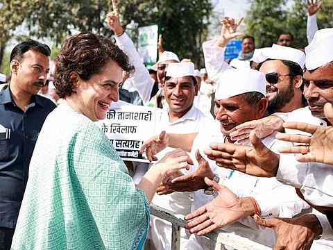 Congress General Secretary Priyanka Gandhi Vadra being greeted by the party workers during the 'Sankalp Satyagraha' against the disqualification of party leader Rahul Gandhi as a Member of Parliament, at Raj Ghat, in New Delhi on Sunday, March 26, 2023.