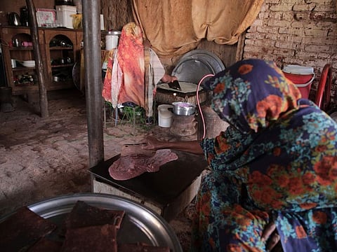 Sudanese women prepare Helo Murr, a Ramadan drink made with dried corn and spices which is then dipped in water, in Khartoum, Sudan, Wednesday, March. 22, 2023, ahead of the fasting month of Ramadan.