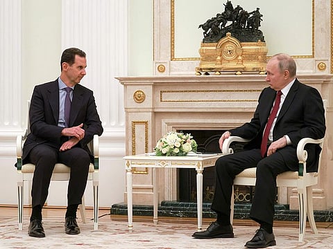 Russian President Vladimir Putin, right, listens to Syrian President Bashar Assad during their meeting at the Kremlin in Moscow, Russia, Wednesday, March 15, 2023.
