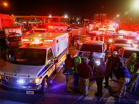 Mexican authorities and firefighters remove injured migrants, mostly Venezuelans, from inside the National Migration Institute (INM) building during a fire, in Ciudad Juarez, Mexico March 27, 2023.
