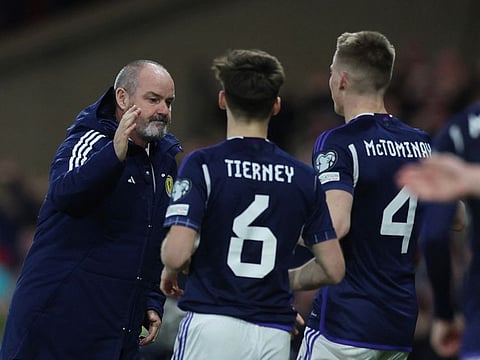 Scotland coach Steve Clarke (left) with Kieran Tierney (centre) and Scott McTominay.