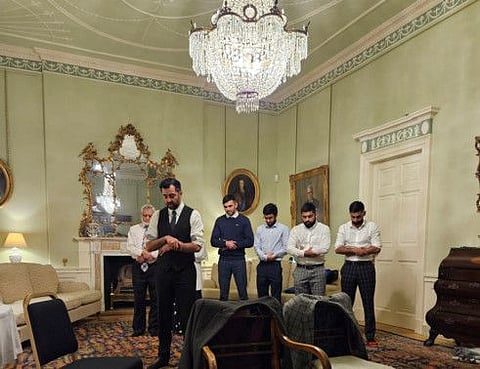 Newly confirmed Scottish First Minister Humza Yousaf leads his family in prayer during their first night at Bute House after breaking fast together during Ramadan, following his win at the Scottish National Party leadership election, in Edinburgh, Scotland, Britain March 28, 2023 in this handout image.