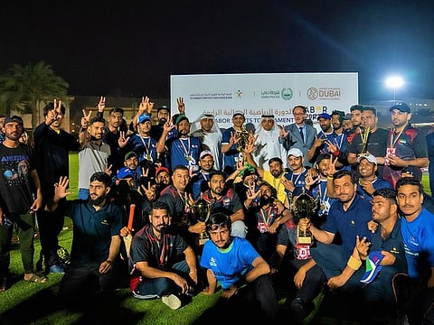 Winning team! Enoc won the cricket competition at the Labour Sports Tournament.
