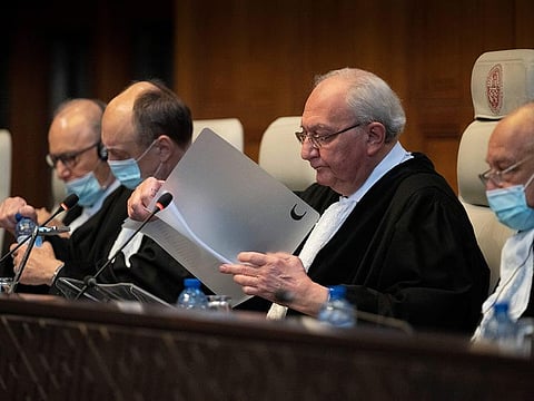 Judge and vice-president Kirill Gevorgian of Russia, second right, starts reading the verdict of The International Court of Justice, in The Hague, Netherlands, Thursday, March 30, 2023.