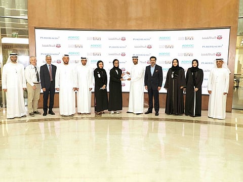 Officials standing for photo at the ceremony to recognise the Abu Dhabi Stem Cell Centre as a centre of excellence by the Department of Health, Abu Dhabi