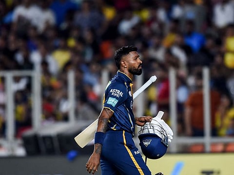Gujarat Titans' Hardik Pandya walks back to the pavilion after his dismissal during the Indian Premier League (IPL) Twenty20 cricket match against Chennai Super Kings at the Narendra Modi Stadium in Ahmedabad.