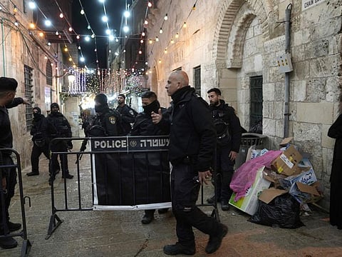 Israeli police close a path leading to the Al Aqsa Mosque compound after shots were fired in the Old City of Jerusalem during Ramadan on April 1, 2023.