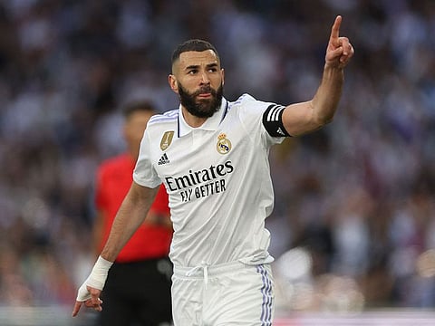Real Madrid's French forward Karim Benzema celebrates scoring his team's second goal during the Spanish league football match between Real Madrid CF and Real Valladolid FC at the Santiago Bernabeu stadium in Madrid.