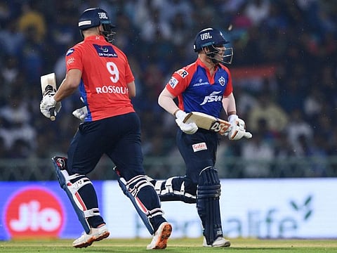Delhi Capitals' captain David Warner (right) and Rilee Rossouw run between the wickets during the Indian Premier League match against Lucknow Super Giants at the Ekana Cricket Stadium in Lucknow.