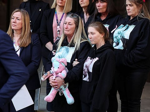 Olivia Pratt-Korbel's mother Cheryl Korbel holds a toy outside Manchester Crown Court following the sentencing of Thomas Cashman in Manchester, Britain .