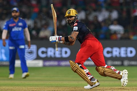 Royal Challengers Bangalore's Virat Kohli plays a shot during the Indian Premier League match against Mumbai Indians at the M Chinnaswamy Stadium in Bengaluru.