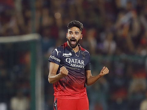 Royal Challengers Bangalore's Mohammad Siraj celebrates a wicket in a match against Mumbai Indians.
