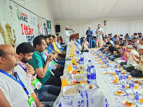 Volunteers serve iftar meals to almost 1,500 people to end their fast every day this Ramadan in this tent run by the Kerala Muslim Cultural Centre in Sharjah..