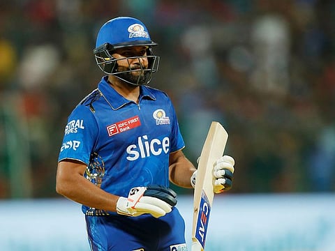 Rohit Sharma of Mumbai Indians returns to the dugout after being dismissed in the IPL match against the Royal Challengers Bangalore at the M. Chinnaswamy Stadium, Bengaluru, on April 2, 2023. Sharma’s lack of runs affects the scoring in the powerplay for Mumbai.