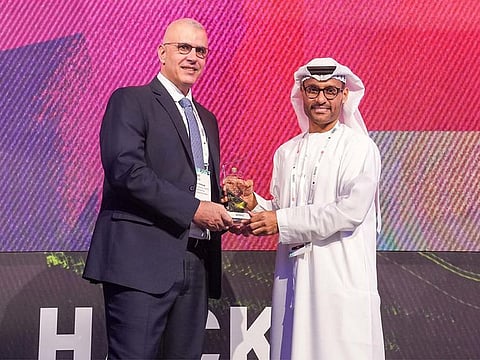 Ned Baltagi of SANS Institute receiving the award from Dr. Mohamed Al Kuwaiti, Head of Cybersecurity of the UAE Government, at GISEC Global 2023