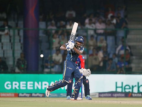 Gujarat Titans' Sai Sudharsan brings up his half-century during the match against Delhi Capitals in the Indian Premier League in New Delhi on Tuesday.