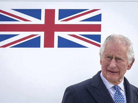 Britain's King Charles III stands in front of the plane after arriving at Berlin Airport in Berlin, Germany, Wednesday, March 29, 2023. King Charles III won plenty of hearts during his three-day visit to Germany, his first foreign trip since becoming king.