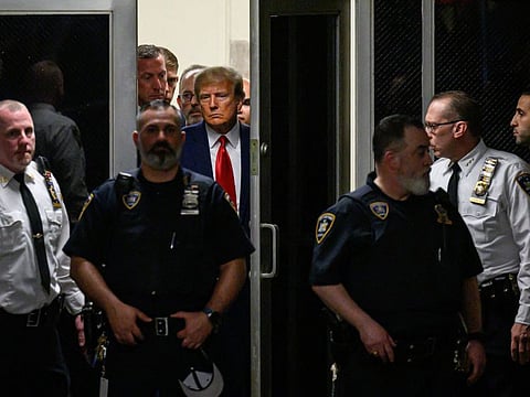 Former US president Donald Trump arrives at the courtroom at the Manhattan Criminal Court in New York on April 4, 2023