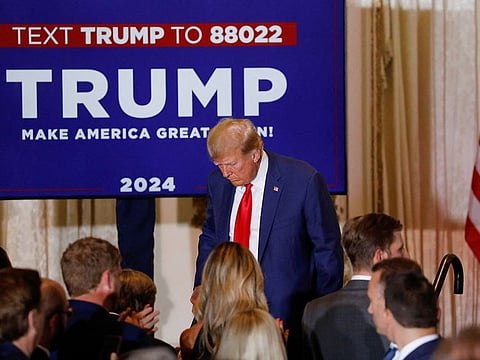 Former US President Donald Trump walks off stage after delivering remarks on the day of his court appearance in New York after being indicted by a Manhattan grand jury following a probe into hush money paid to porn star Stormy Daniels, in Palm Beach, Florida on April 4, 2023.